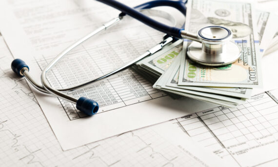 medical debt - image with cash, billing statement, & stethoscope